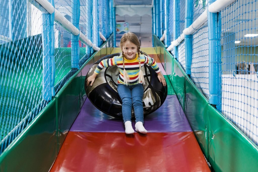 Children exploring and playing at JUEGAMOS BUCK-A-ROOS! Indoor playground in Douglasville, GA, designed to foster learning, engagement, and fun.